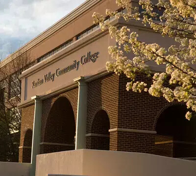 cropped side view of front arches with tree branches