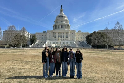 students with capitol in background