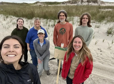 jay kelly and students on beach