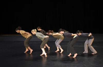 contemporary dancers bent at waist