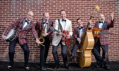 bill haley jr and comets in front of brick wall