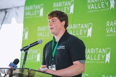ethan tassio at podium