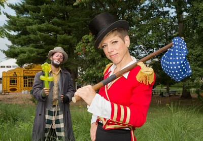 clown and performer in red jacket