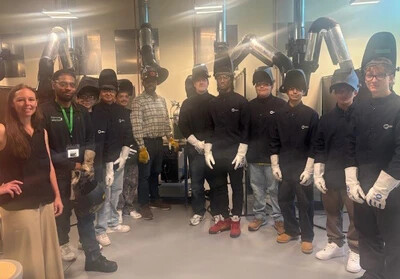 welding students in gear standing