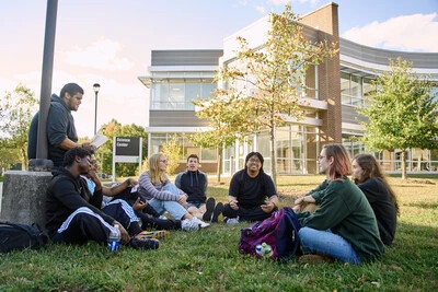 RVCC students lounging on the grass.