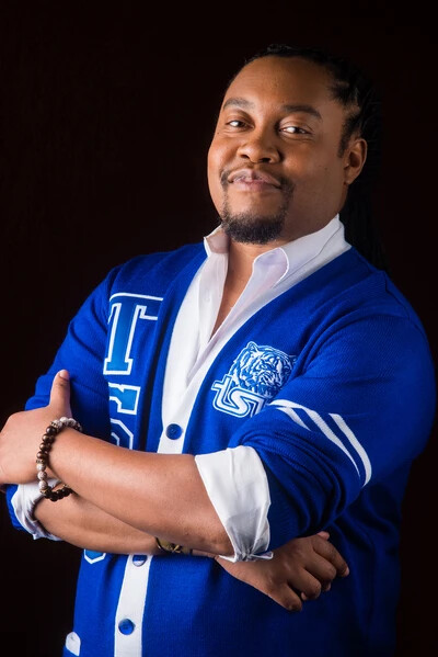 jonathan blanchard in royal blue varsity sweater