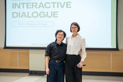 2 students with interactive dialogue written on screen behind them