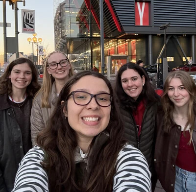 group of 5 female students with 2 in glasses