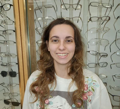 hunter nicholaysen in front of glasses on display