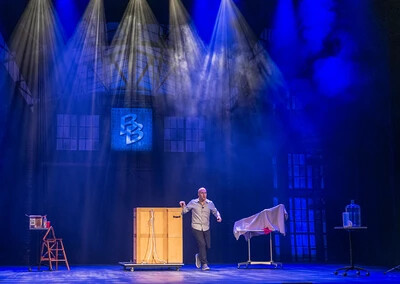 bill blagg with objects on stage under lights