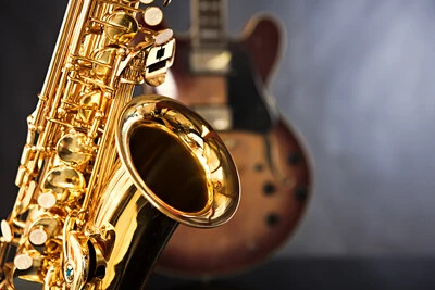 sax with guitar behind it
