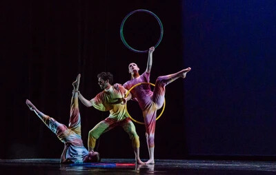three dancers with hula hoop
