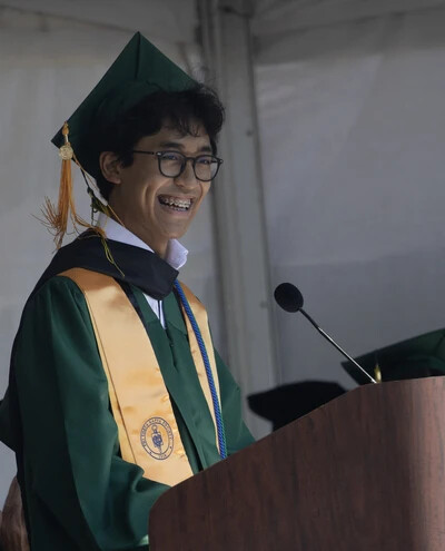 student speaker sam at podium