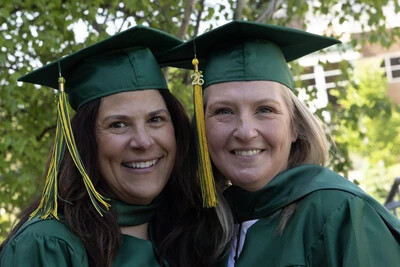 2 older female grads