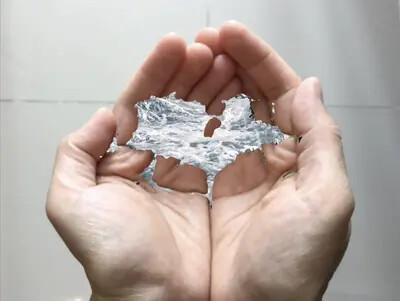 picture of cupped gands with images of ocean inside