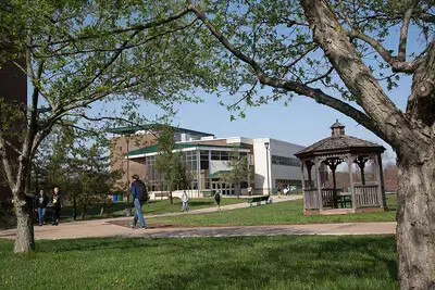 student walking outside near gazebo