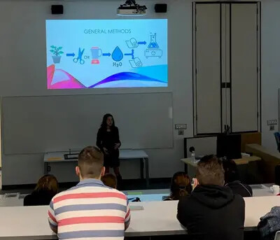 female student speaking to group