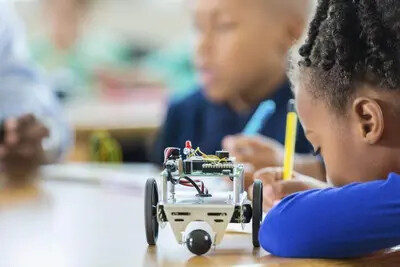 child with robotics kit