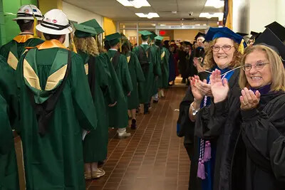 faculty clapping for grads