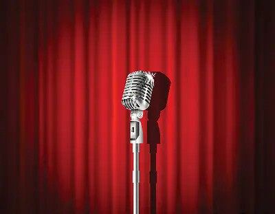 microphone in front of red curtain
