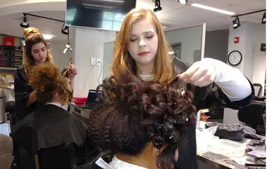 2 students styling period hair