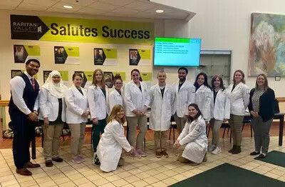 group of OTA students by Success Wall