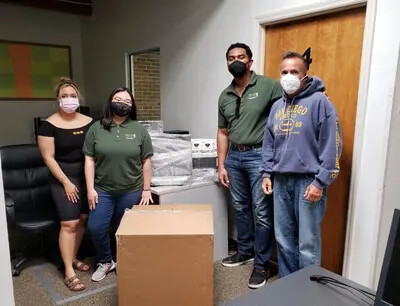 rvcc ota students with collected boxes of technology