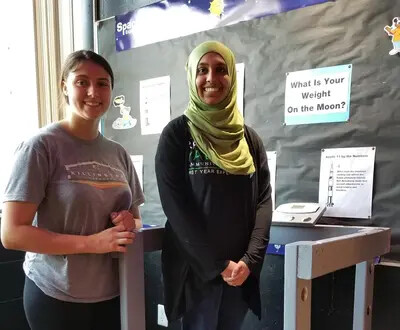 2 female students and moon-scale