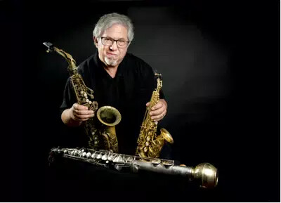 paul cohen holding saxes