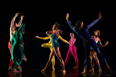group of dancers in colorful costumes