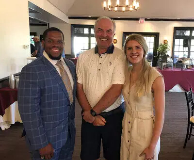 mike with 2 students at golf classic