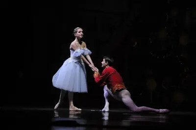 male ballet dancer on knee before ballerina