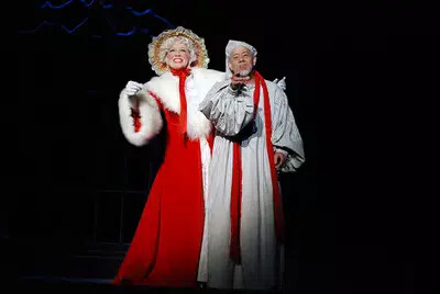 man in night shirt and woman in red robe
