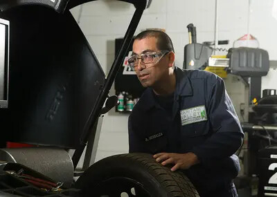 student working on car