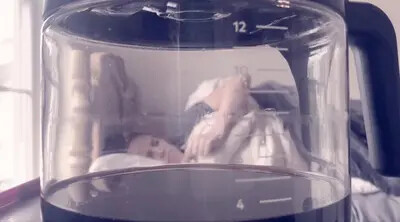 woman lying down viewed through glass