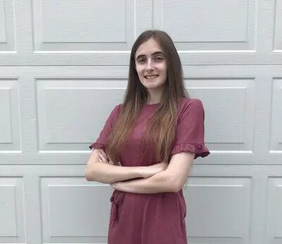 daniella marzigliano against a gray background