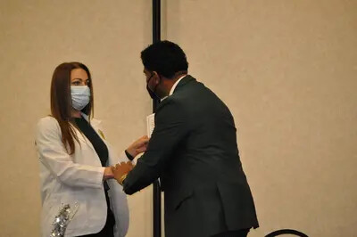 beau younker with female ota student at pinning ceremony