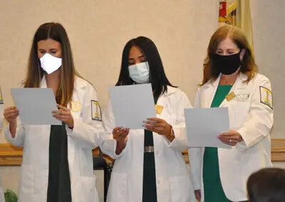 3 ota students at pinning ceremony