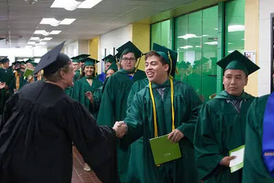 line of grades with handshake