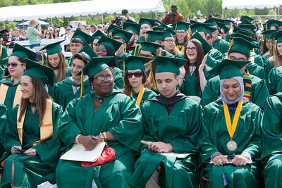 seated graduates at commencement