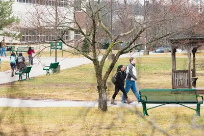students walking near gazebo