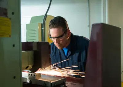 student soddering with sparks