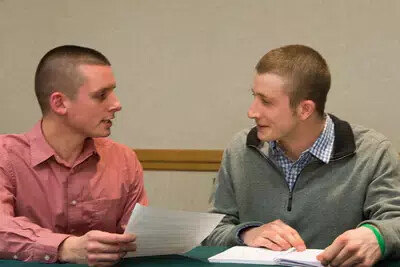 sanofi mentor and rvcc male student looking at each other