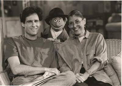 black and white image of author, puppet and another person