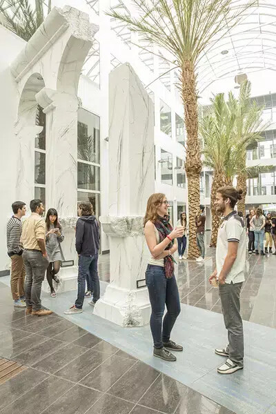 renne palm trees male and female chatting