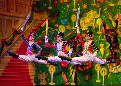 3 nutcracker dancers leaping in air