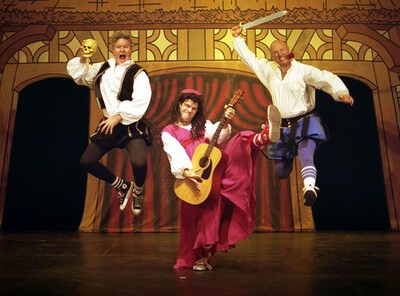 reduced shakespeare actors jumping in air