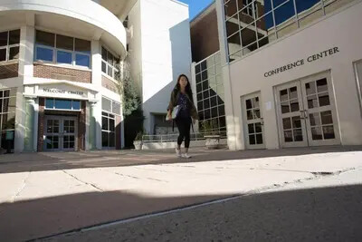 woman walking near front entrance