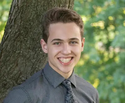 samuel cartagena-sergenian outside against a tree