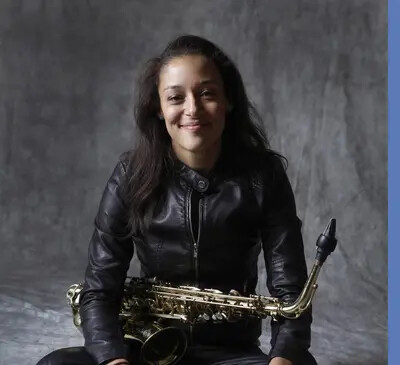 woman holding sax in her lap